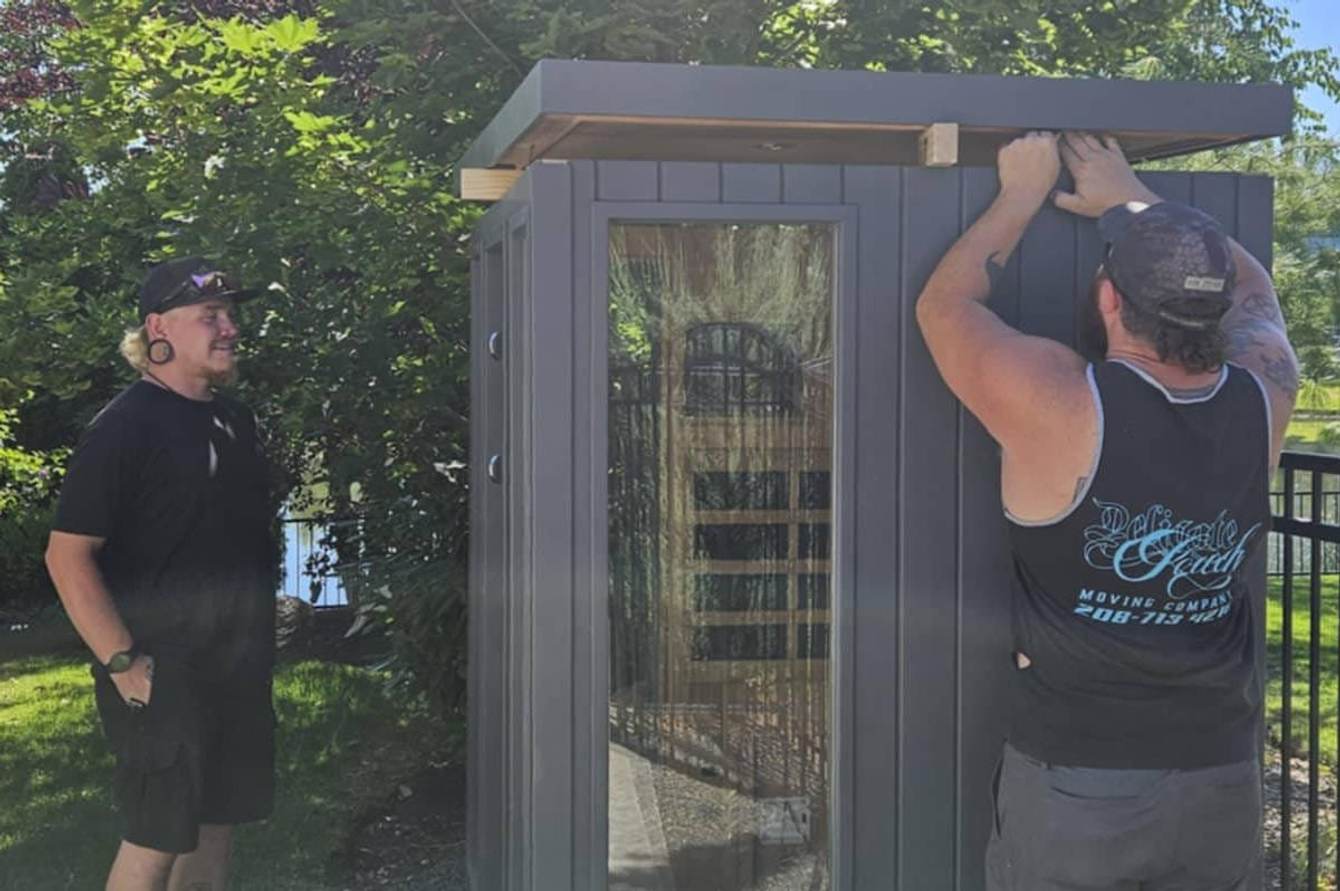 Delicate Touch Moving crew moving a barrel sauna