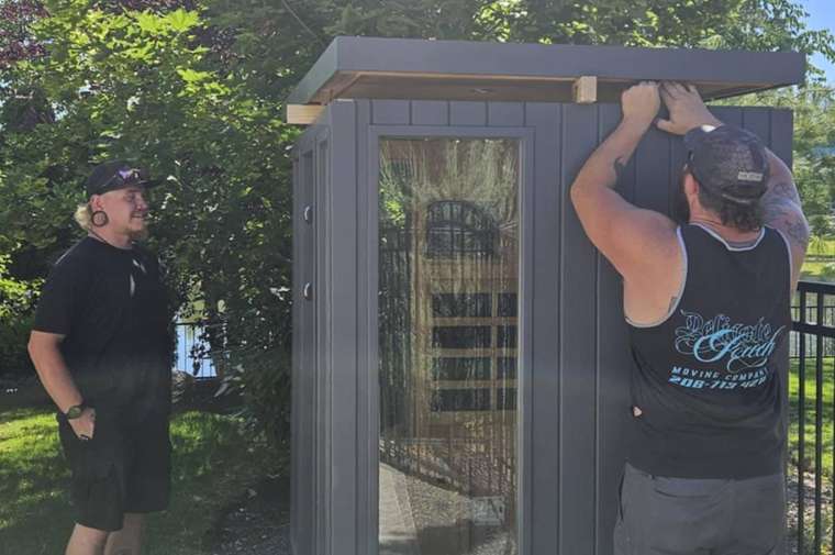 Delicate Touch Moving crew moving a barrel sauna